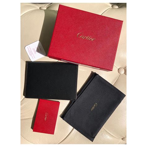 cartier passport holder.